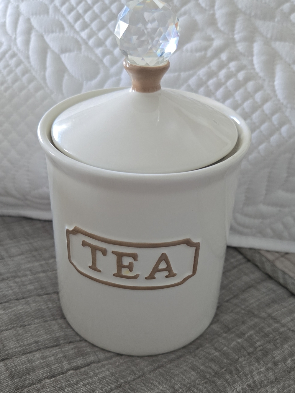 White Ceramic Tea Canister with Beige Accent and Crystal Knob